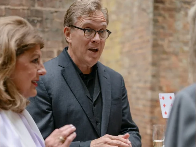 Rich Crawford performing close-up magic at a wedding cocktail hour